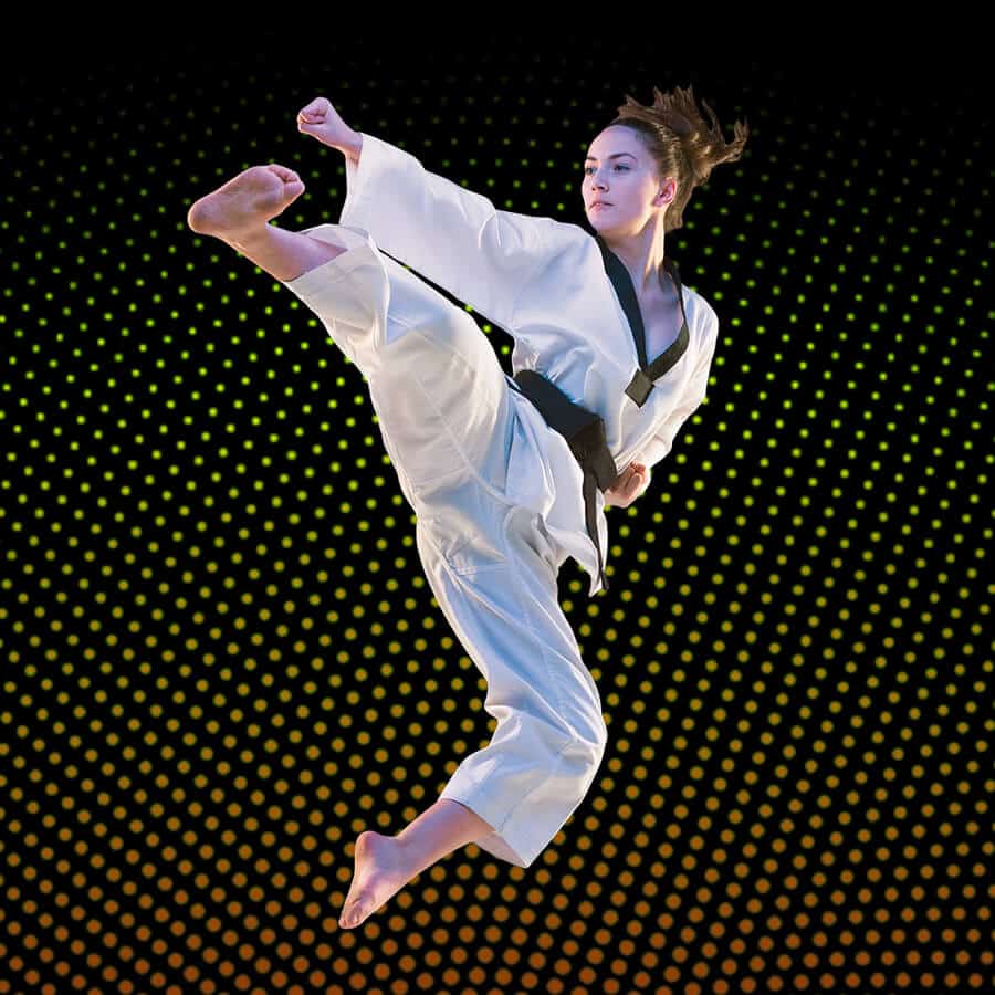 Martial Arts Lessons for Adults in Butte MT - Girl Black Belt Jumping High Kick